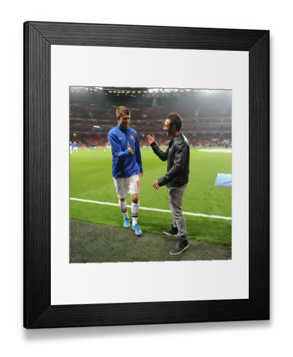 Framed Print : Arsenal Duo: Santi Cazorla and Aaron Ramsey Share a Moment Before Arsenal v Napoli, 2013-14 UEFA Champions League