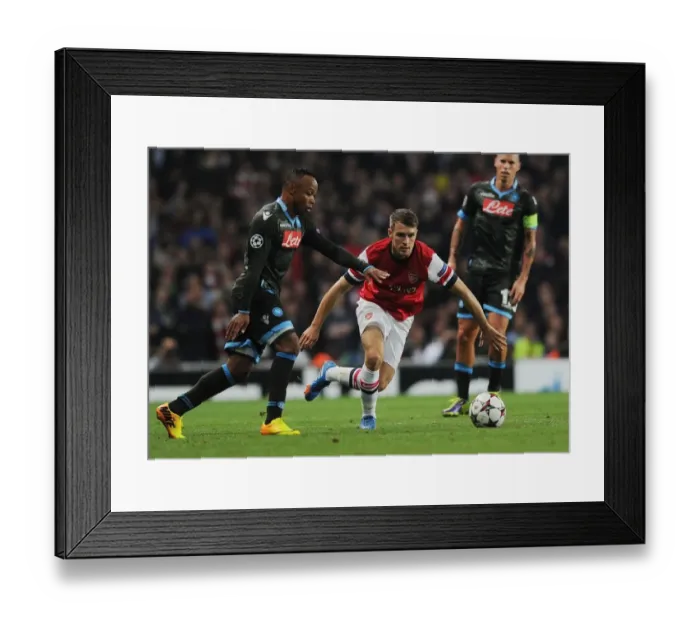Framed Print : Arsenal's Ramsey Outmaneuvers Napoli's Zuniga in 2013-14 Champions League Clash Framed Print : Arsenal's Ramsey Outmaneuvers Napoli's Zuniga in 2013-14 Champions League Clash
