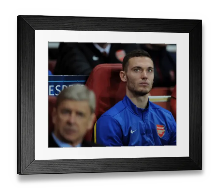 Framed Print : Thomas Vermaelen Focuses in Arsenal's UEFA Champions League Clash Against Napoli (2013-14) Framed Print : Thomas Vermaelen Focuses in Arsenal's UEFA Champions League Clash Against Napoli (2013-14)
