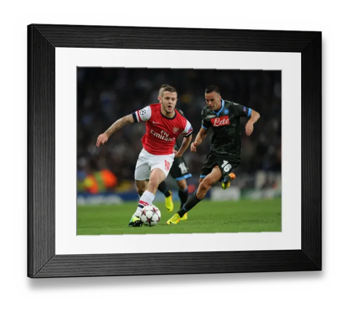 Framed Print : Clash of Midfield Titans: Jack Wilshere vs. Giandomenico Mesto - Arsenal vs. Napoli, UEFA Champions League, 2013