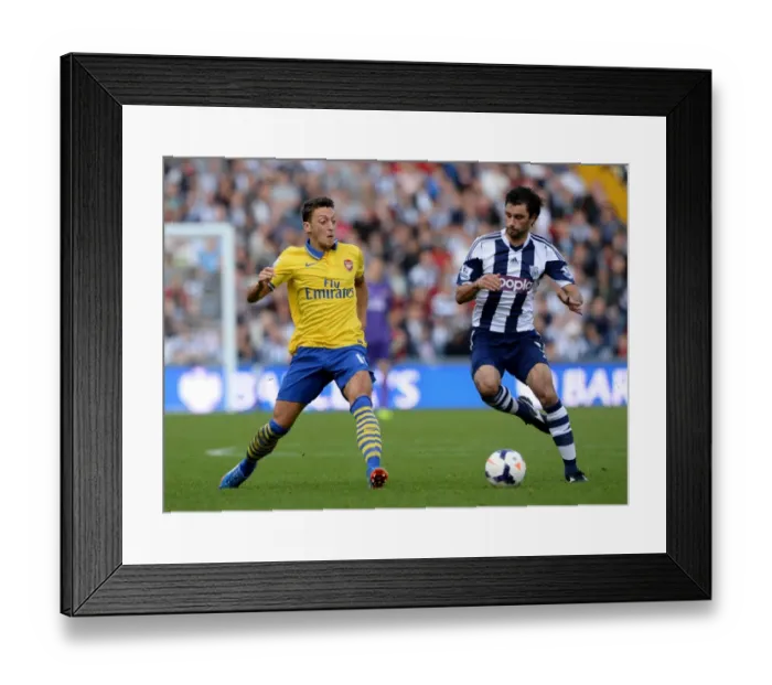 Framed Print : Mesut Ozil vs Claudio Yacob: A Premier League Battle
