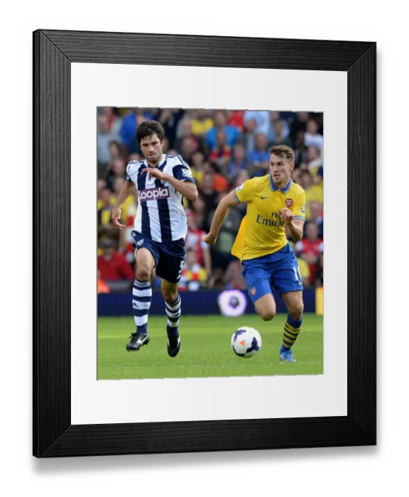 Framed Print : Aaron Ramsey vs. Claudio Yacob: Intense Battle in West Bromwich Albion vs. Arsenal (2013-14)