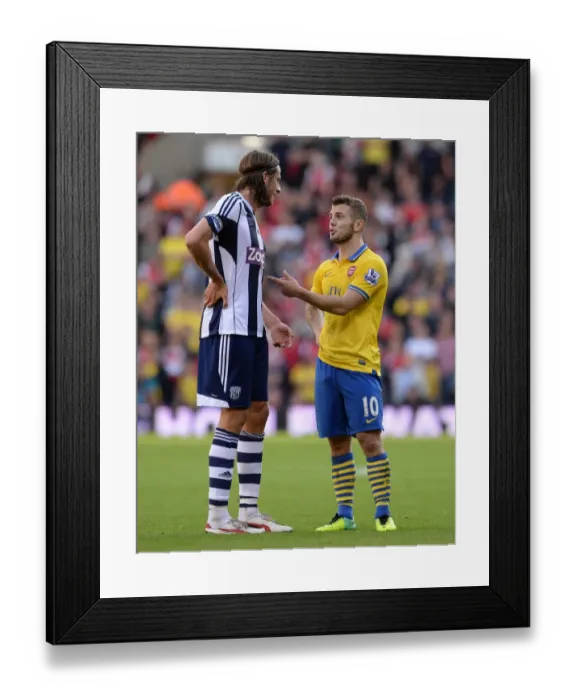Framed Print : A Moment of Sportsmanship: Wilshere and Olsson's Calm Exchange Amidst West Bromwich Albion vs. Arsenal Rivalry (2013-14)