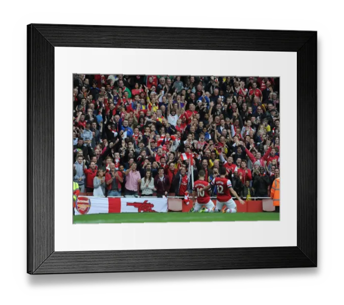 Framed Print : Arsenal fans celebrate the 1st goal scored by Jack Wilshere. Arsenal 4: 1 Norwich City