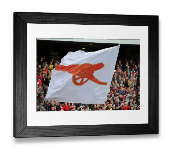 Framed Print : A flag is waved before the match. Arsenal 4: 1 Norwich City. Barclays Premier League