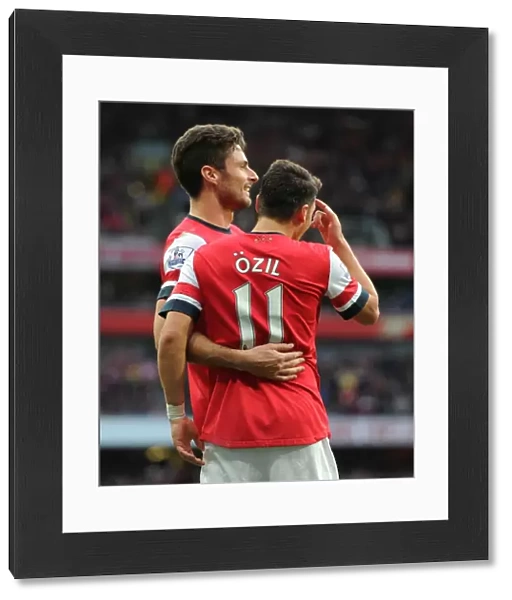 Mesut Ozil celebrates scoring his 1st goal, Arsenals 2nd, with Olivier Giroud. Arsenal 4