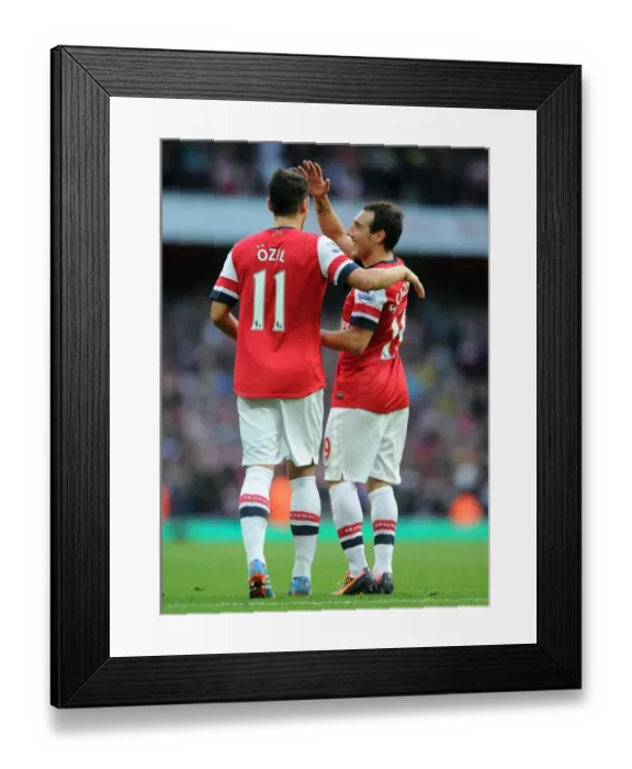 Framed Print : Mesut Ozil and Santi Cazorla Celebrate Arsenal's Goals Against Norwich City, 2013-14 Season Framed Print : Mesut Ozil and Santi Cazorla Celebrate Arsenal's Goals Against Norwich City, 2013-14 Season