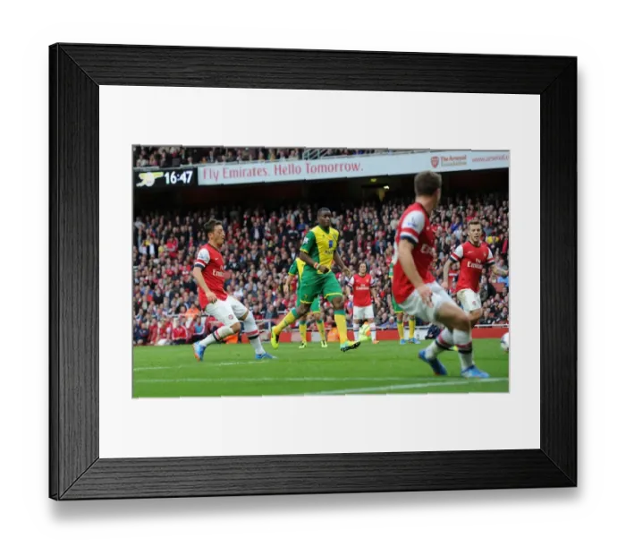 Framed Print : Mesut Ozil Scores Arsenal's Fourth Goal Against Norwich City, 2013-14 Season Framed Print : Mesut Ozil Scores Arsenal's Fourth Goal Against Norwich City, 2013-14 Season