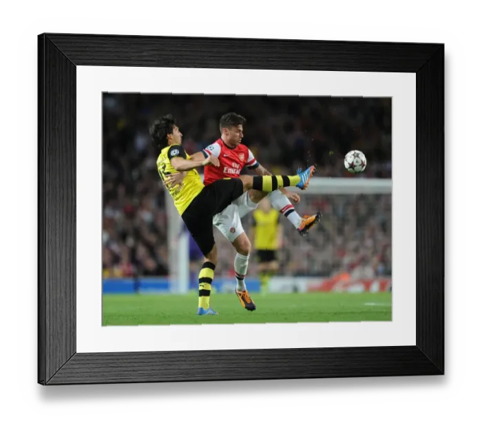 Framed Print : Clash of Titans: Giroud vs. Hummels - Arsenal vs. Borussia Dortmund, UEFA Champions League