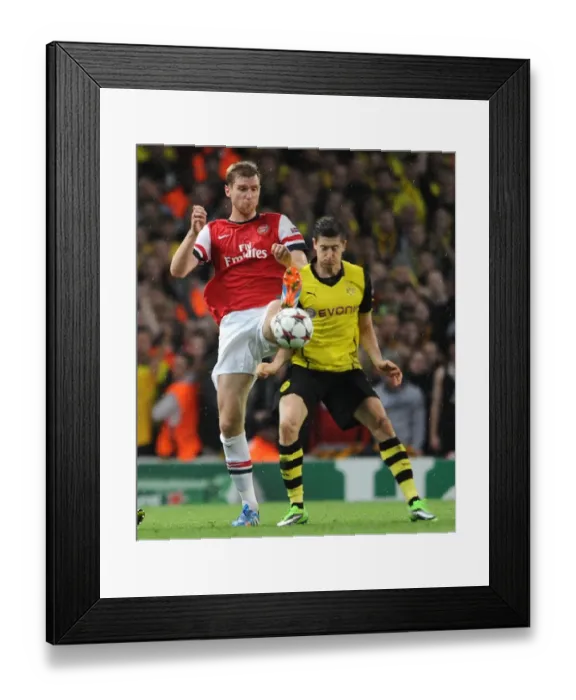 Framed Print : Arsenal vs Borussia Dortmund: Mertesacker vs Lewandowski - UEFA Champions League Showdown Framed Print : Arsenal vs Borussia Dortmund: Mertesacker vs Lewandowski - UEFA Champions League Showdown