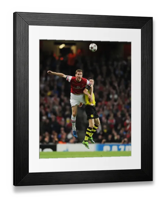 Framed Print : Mertesacker vs Lewandowski: A Battle at the Emirates - Arsenal vs Borussia Dortmund, UEFA Champions League Framed Print : Mertesacker vs Lewandowski: A Battle at the Emirates - Arsenal vs Borussia Dortmund, UEFA Champions League