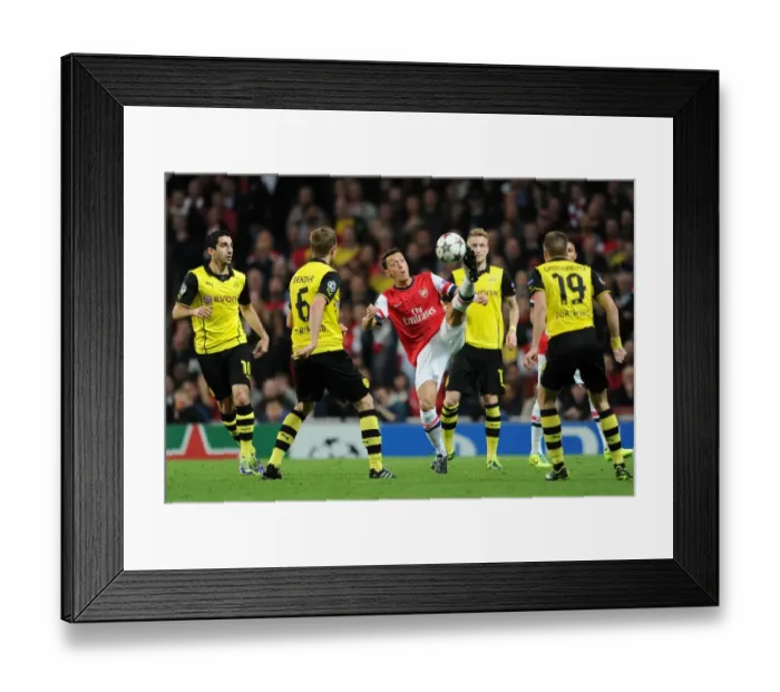 Framed Print : Mesut Ozil Faces Off Against Sven Bender and Henrikh Mkhitaryan: Arsenal vs Borussia Dortmund, UEFA Champions League