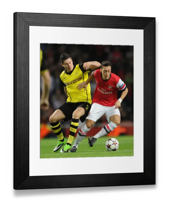Framed Print : Mesut Ozil vs. Robert Lewandowski: A Battle at the Emirates - Arsenal v Borussia Dortmund, UEFA Champions League (2013)