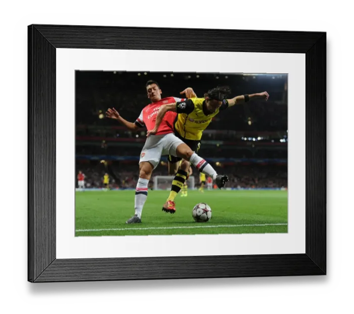 Framed Print : Clash of the Midfield Maestros: Ozil vs. Hummels - Arsenal vs. Borussia Dortmund, UEFA Champions League Framed Print : Clash of the Midfield Maestros: Ozil vs. Hummels - Arsenal vs. Borussia Dortmund, UEFA Champions League