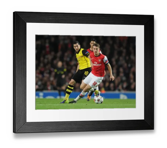 Framed Print : Arsenal's Aaron Ramsey Outwits Mkhitaryan in Thrilling 2013-14 Champions League Clash