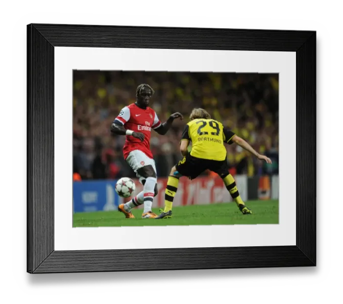 Framed Print : Arsenal vs. Borussia Dortmund: Clash of Sagna and Schelzer in the 2013-14 UEFA Champions League Framed Print : Arsenal vs. Borussia Dortmund: Clash of Sagna and Schelzer in the 2013-14 UEFA Champions League