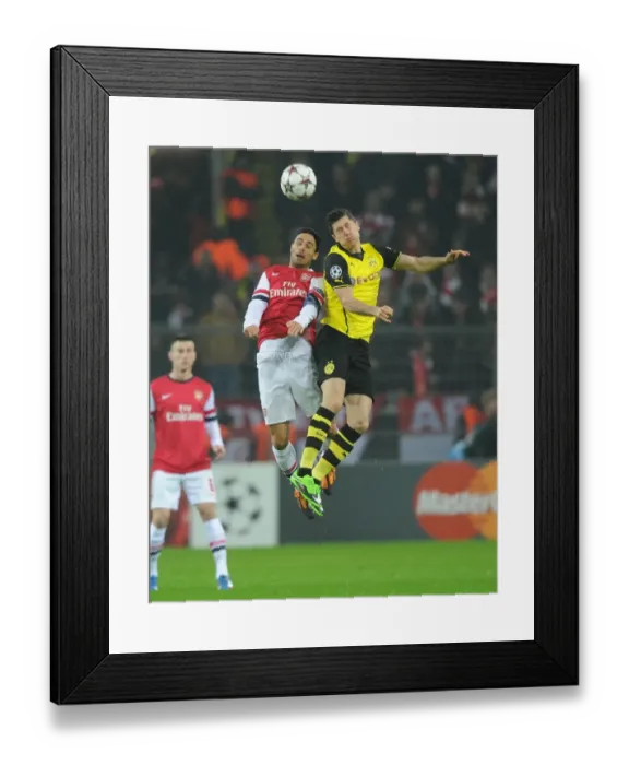 Framed Print : Mikel Arteta vs. Robert Lewandowski: A Battle in the 2013-14 Borussia Dortmund vs. Arsenal UEFA Champions League Match