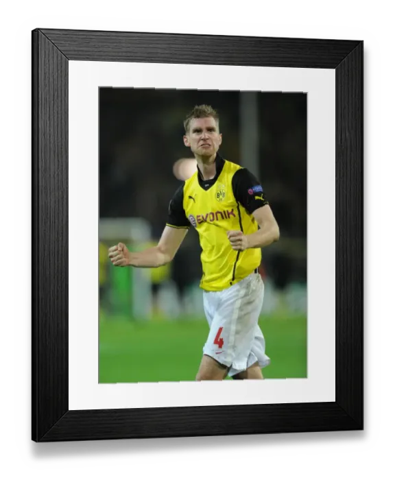 Framed Print : Per Mertesacker's Triumph: Borussia Dortmund vs. Arsenal, UEFA Champions League (2013) Framed Print : Per Mertesacker's Triumph: Borussia Dortmund vs. Arsenal, UEFA Champions League (2013)