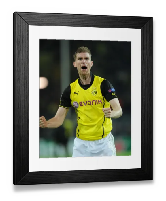 Framed Print : Per Mertesacker's Champion Moment: Arsenal's Historic Win at Borussia Dortmund, UEFA Champions League (2013)