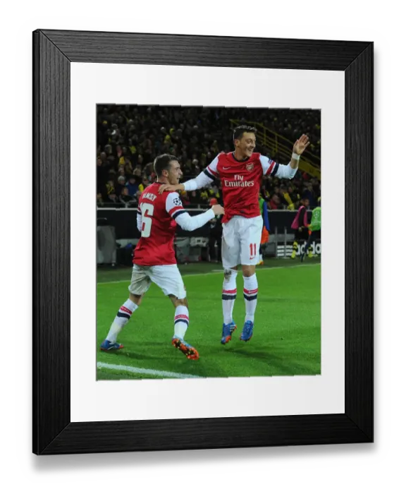 Framed Print : Unforgettable Goal Celebration: Ramsey and Ozil's Strike for Arsenal at Borussia Dortmund, UEFA Champions League (2013-14) Framed Print : Unforgettable Goal Celebration: Ramsey and Ozil's Strike for Arsenal at Borussia Dortmund, UEFA Champions League (2013-14)