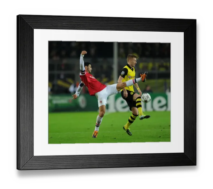 Framed Print : Mikel Arteta vs. Marco Reus: Intense Clash in Borussia Dortmund vs. Arsenal UEFA Champions League Match Framed Print : Mikel Arteta vs. Marco Reus: Intense Clash in Borussia Dortmund vs. Arsenal UEFA Champions League Match