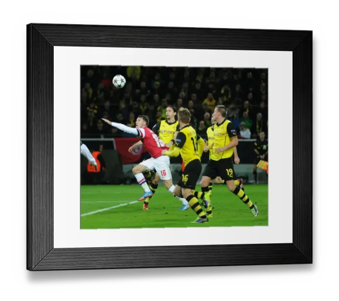 Framed Print : Ramsey Strikes: Arsenal's Winning Moment Against Dortmund in the Champions League Framed Print : Ramsey Strikes: Arsenal's Winning Moment Against Dortmund in the Champions League