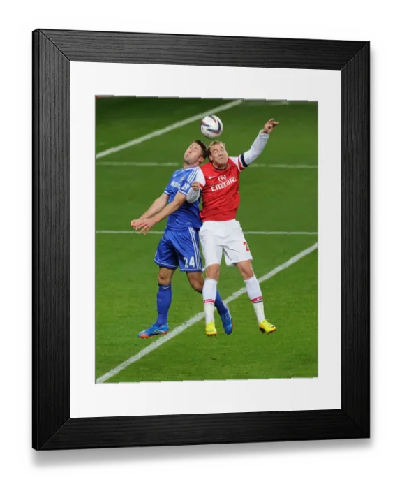 Framed Print : Clash of Giants: Bendtner vs. Cahill - Arsenal vs. Chelsea, Capital One Cup 2013-14