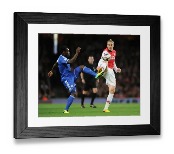 Framed Print : Bendtner vs. Essien: A Football Rivalry Ignites in the Arsenal vs. Chelsea Capital One Cup Clash