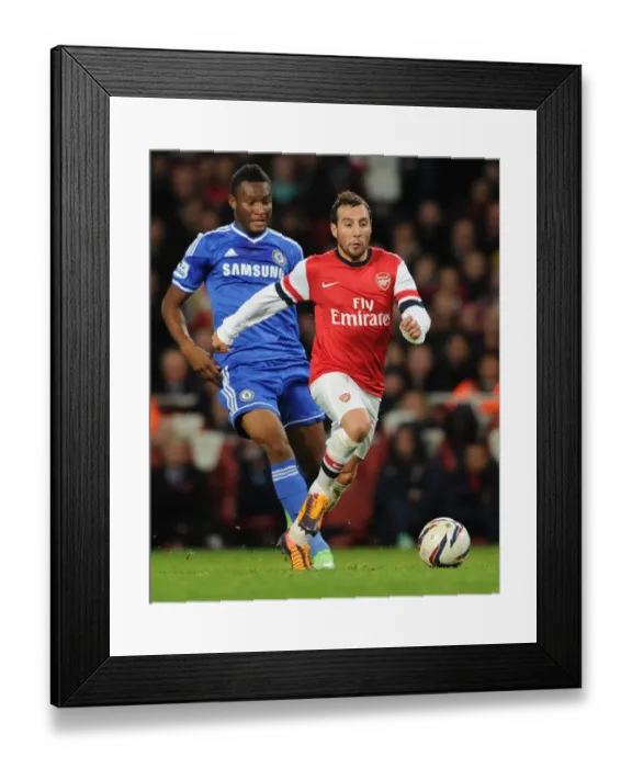 Framed Print : Arsenal's Santi Cazorla Clashes with Chelsea's John Obi Mikel in Capital One Cup Showdown Framed Print : Arsenal's Santi Cazorla Clashes with Chelsea's John Obi Mikel in Capital One Cup Showdown