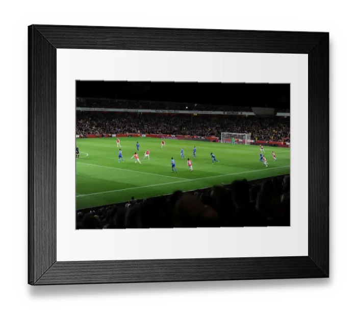 Framed Print : Arsenal vs Chelsea Showdown: Capital One Cup Battle at Emirates Stadium