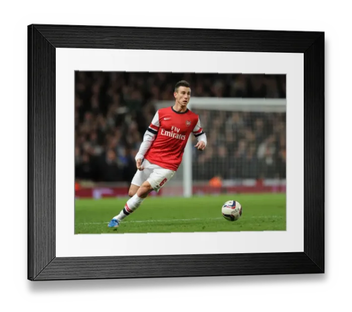 Framed Print : Arsenal's Koscielny Faces Off Against Chelsea in Capital One Cup Showdown