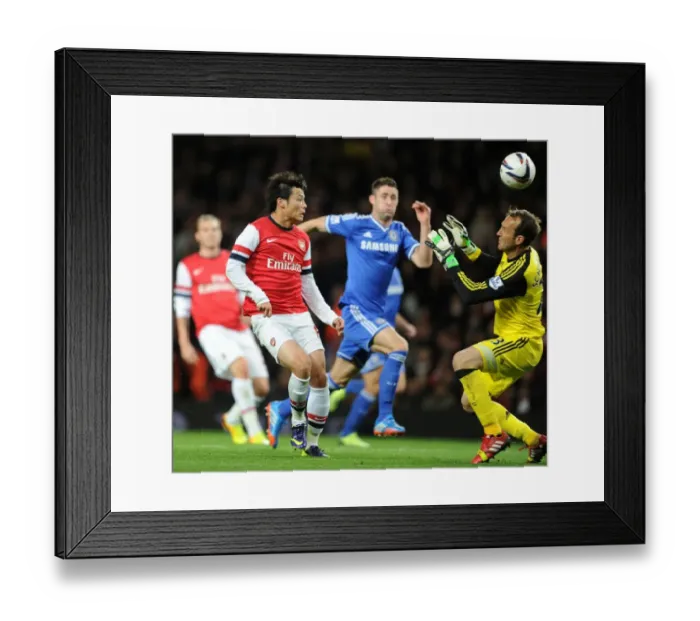 Framed Print : Arsenal's Ryo Miyaichi Outmaneuvers Chelsea's Mark Schwarzer in Capital One Cup Clash Framed Print : Arsenal's Ryo Miyaichi Outmaneuvers Chelsea's Mark Schwarzer in Capital One Cup Clash