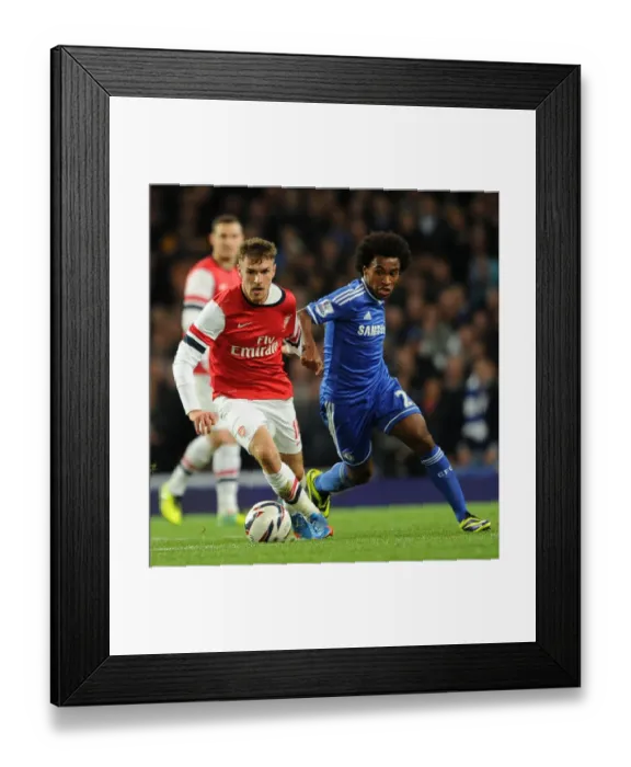 Framed Print : Arsenal's Aaron Ramsey Outmaneuvers Chelsea's William in Capital One Cup Showdown Framed Print : Arsenal's Aaron Ramsey Outmaneuvers Chelsea's William in Capital One Cup Showdown