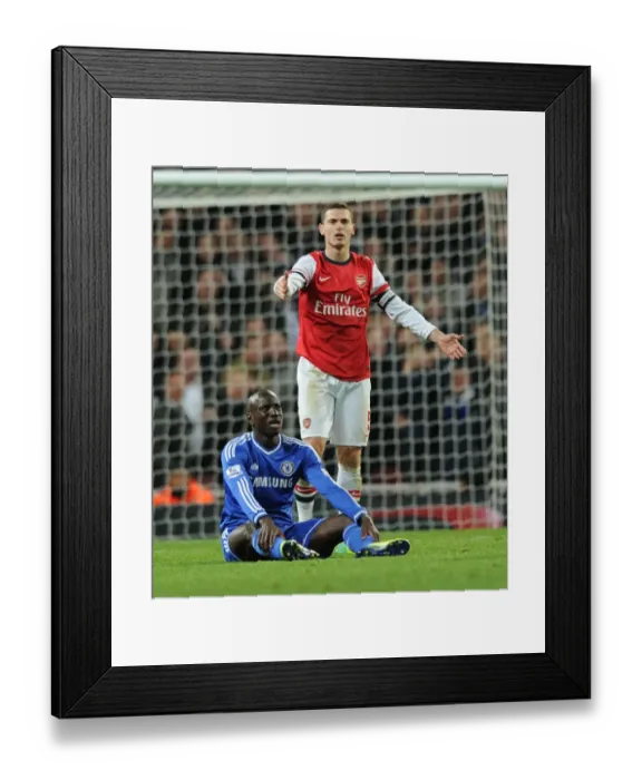 Framed Print : Arsenal vs. Chelsea: Vermaelen Stares Down Ba in Capital One Cup Clash