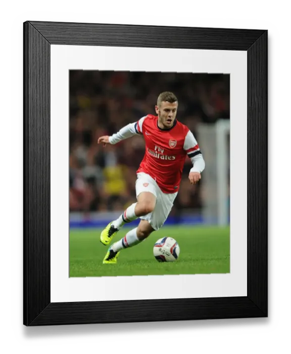 Framed Print : Jack Wilshere Focuses in Arsenal's Capital One Cup Clash Against Chelsea