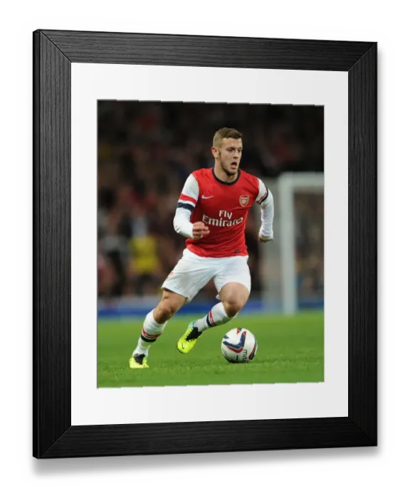 Framed Print : Jack Wilshere Focuses in Arsenal's Capital One Cup Battle Against Chelsea