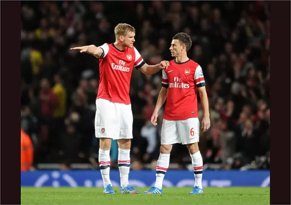Per Mertesacker and Laurent Koscielny (Arsenal). Arsenal 2: 0 Liverpool. Barclays Premier League
