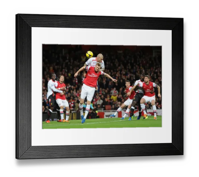 Framed Print : Per Mertesacker (Arsenal0 Martin Skrtel (Liverpool). Arsenal 2: 0 Liverpool. Barclays Premier League