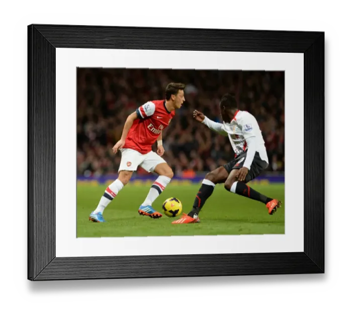 Framed Print : Mesut Ozil (Arsenal) Aly Cissokho (Liverpool). Arsenal 2: 0 Arsenal. Barclays Premier League Framed Print : Mesut Ozil (Arsenal) Aly Cissokho (Liverpool). Arsenal 2: 0 Arsenal. Barclays Premier League