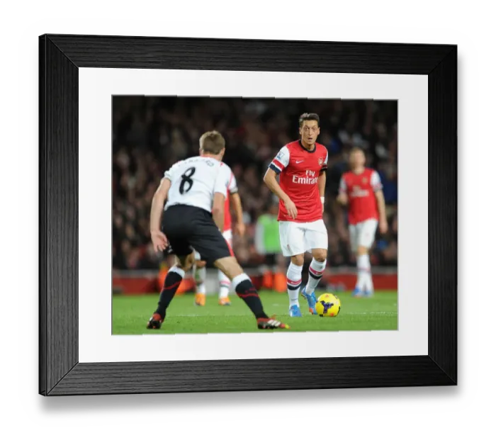 Framed Print : Mesut Ozil (arsenal) Steven Gerrard (Liverpool). Arsenal 2: 0 Liverpool. Barclays Premier League Framed Print : Mesut Ozil (arsenal) Steven Gerrard (Liverpool). Arsenal 2: 0 Liverpool. Barclays Premier League