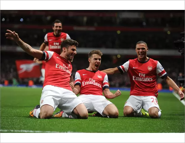 Arsenal's Triumph: Ramsey, Giroud, and Gibbs Celebrate Goals Against Liverpool (2013-14)