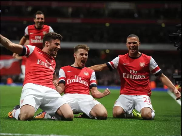 Arsenal's Triumph: Ramsey, Giroud, and Gibbs Celebrate Goals Against Liverpool (2013-14)