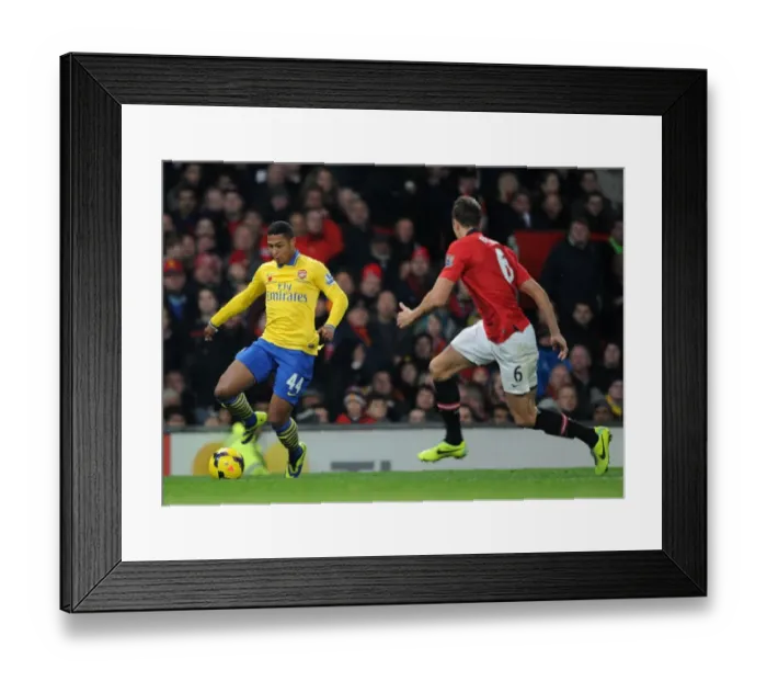 Framed Print : Serge Gnabry Charges Past Jonny Evans: Manchester United vs. Arsenal, Premier League 2013-14 Framed Print : Serge Gnabry Charges Past Jonny Evans: Manchester United vs. Arsenal, Premier League 2013-14
