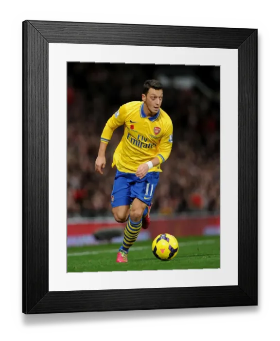 Framed Print : Clash of the Stars: Mesut Ozil vs Manchester United (2013-14)