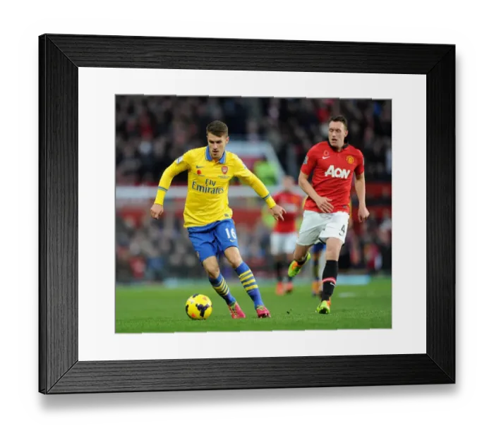 Framed Print : Aaron Ramsey Outmaneuvers Phil Jones: Manchester United vs. Arsenal, Premier League, 2013