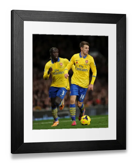 Framed Print : Sagna and Ramsey: Arsenal's Unyielding Duo at Old Trafford (Manchester United v Arsenal 2013-14) Framed Print : Sagna and Ramsey: Arsenal's Unyielding Duo at Old Trafford (Manchester United v Arsenal 2013-14)