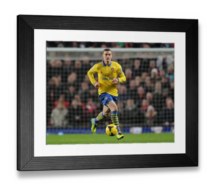 Framed Print : Thomas Vermaelen: Arsenal at Old Trafford Against Manchester United (2013-14) Framed Print : Thomas Vermaelen: Arsenal at Old Trafford Against Manchester United (2013-14)