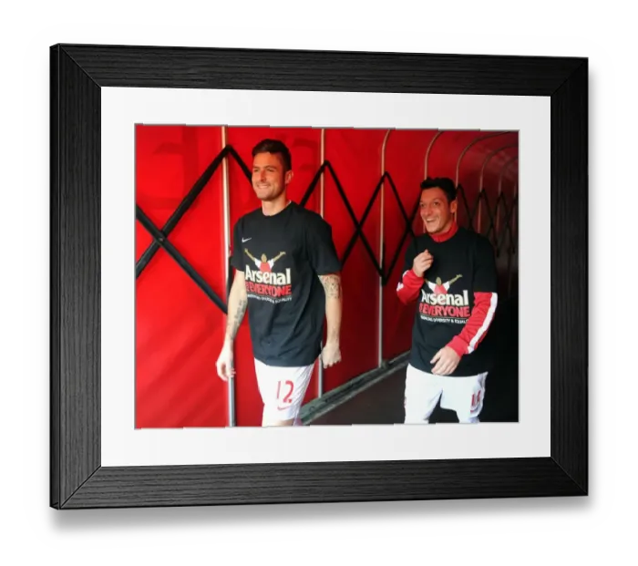 Framed Print : Arsenal's Giroud and Ozil Unite in Arsenal For Everyone T-Shirts (Arsenal v Southampton, 2013-14) Framed Print : Arsenal's Giroud and Ozil Unite in Arsenal For Everyone T-Shirts (Arsenal v Southampton, 2013-14)