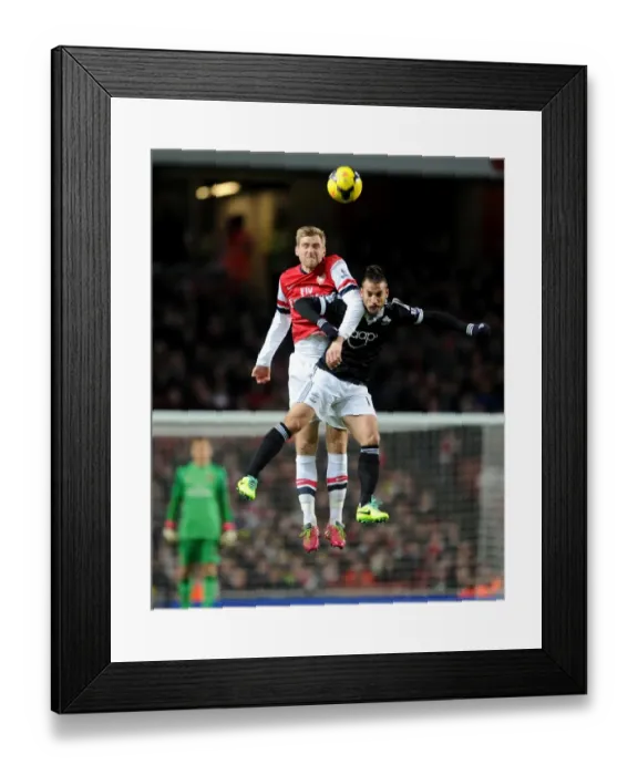 Framed Print : Per Mertesacker (Arsenal) Dani Osvaldo (Southampton). Arsenal 2: 0 Southampton. Barclays