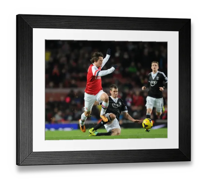 Framed Print : Arsenal's Rosicky Leaps Past Southampton's Schneiderlin (2013-14)